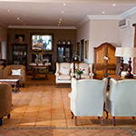 Big lounge with library for guests to relax. Surrounded by view of spectacular Durban skyline.